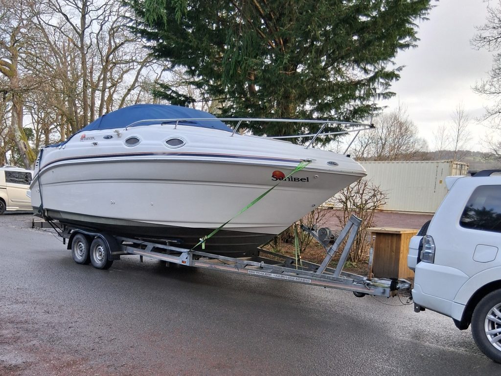 a cruiser powerboat on a trailer